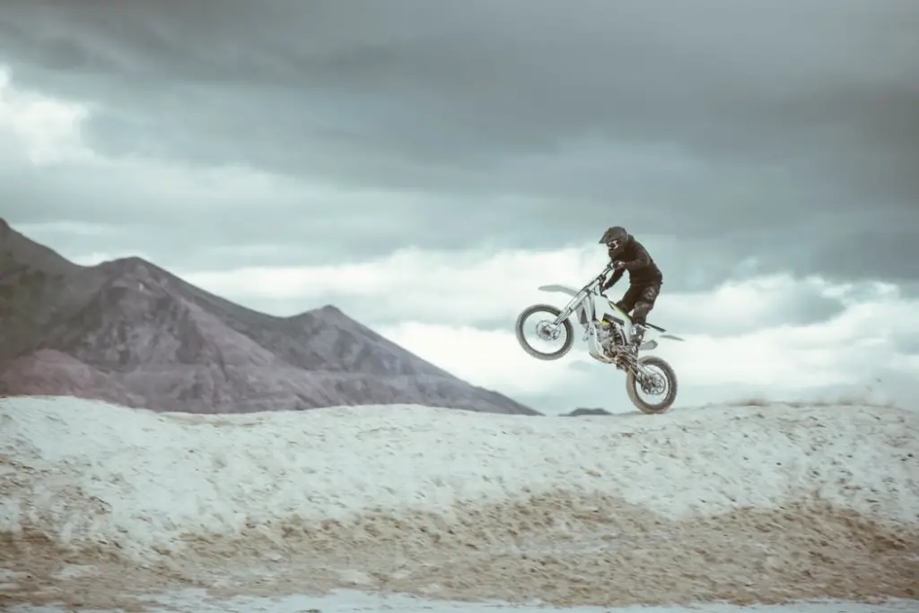 Standing wheelie body position (the front wheel is raised a bit lower than that of a seated wheelie). Also makes it easier to control.