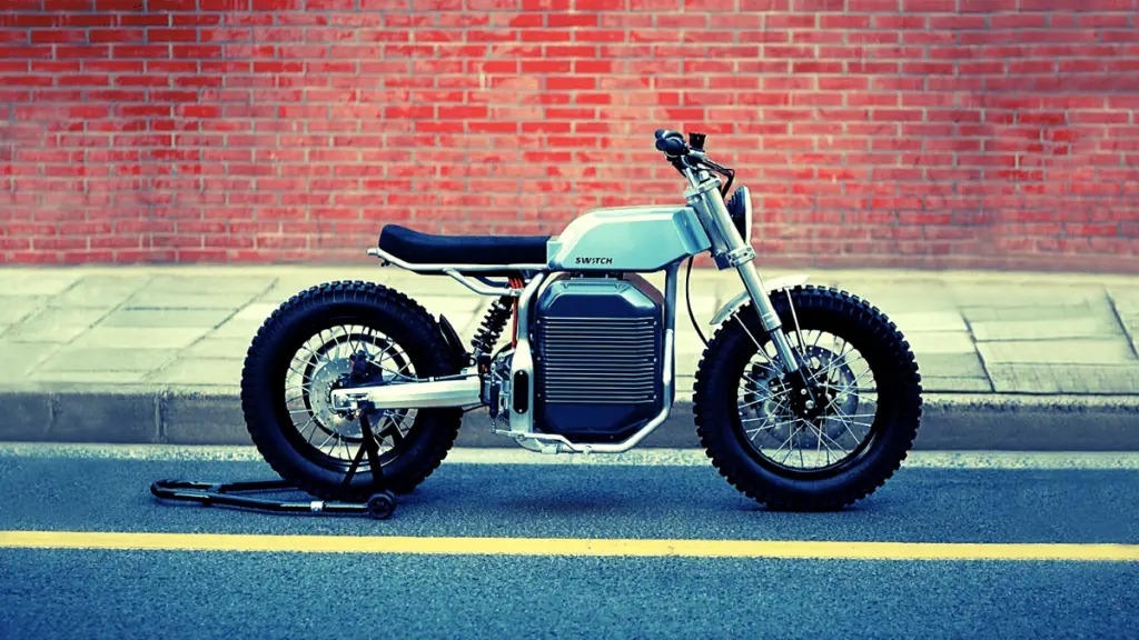 "This lateral shot by Switch greatly showcases the eScrambler’s retro-modern beauty. The Electric scrambler motorcycle takes on a brat style with bobbed rear and front fenders."